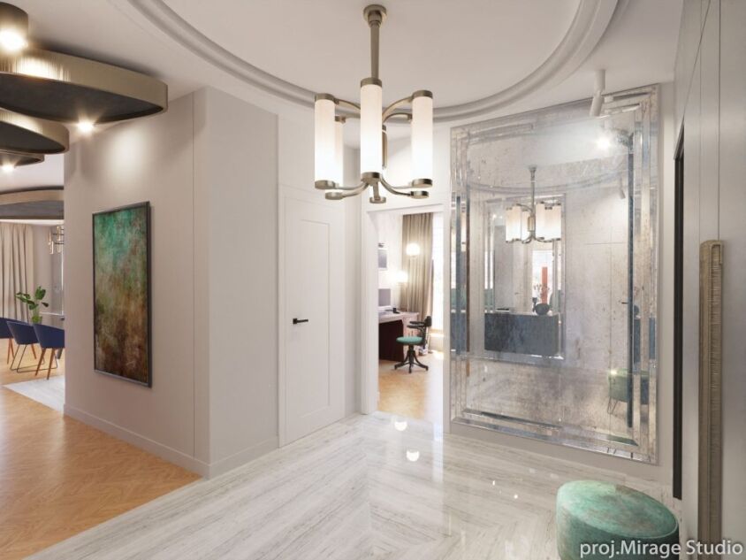 ultramaryna-mosiadz-apartament-mokotow-10 Projekt wnętrza apartamentu Mokotów z eleganckim przedpokojem z dużym postarzanym lustrem i marmurową podłogą.
